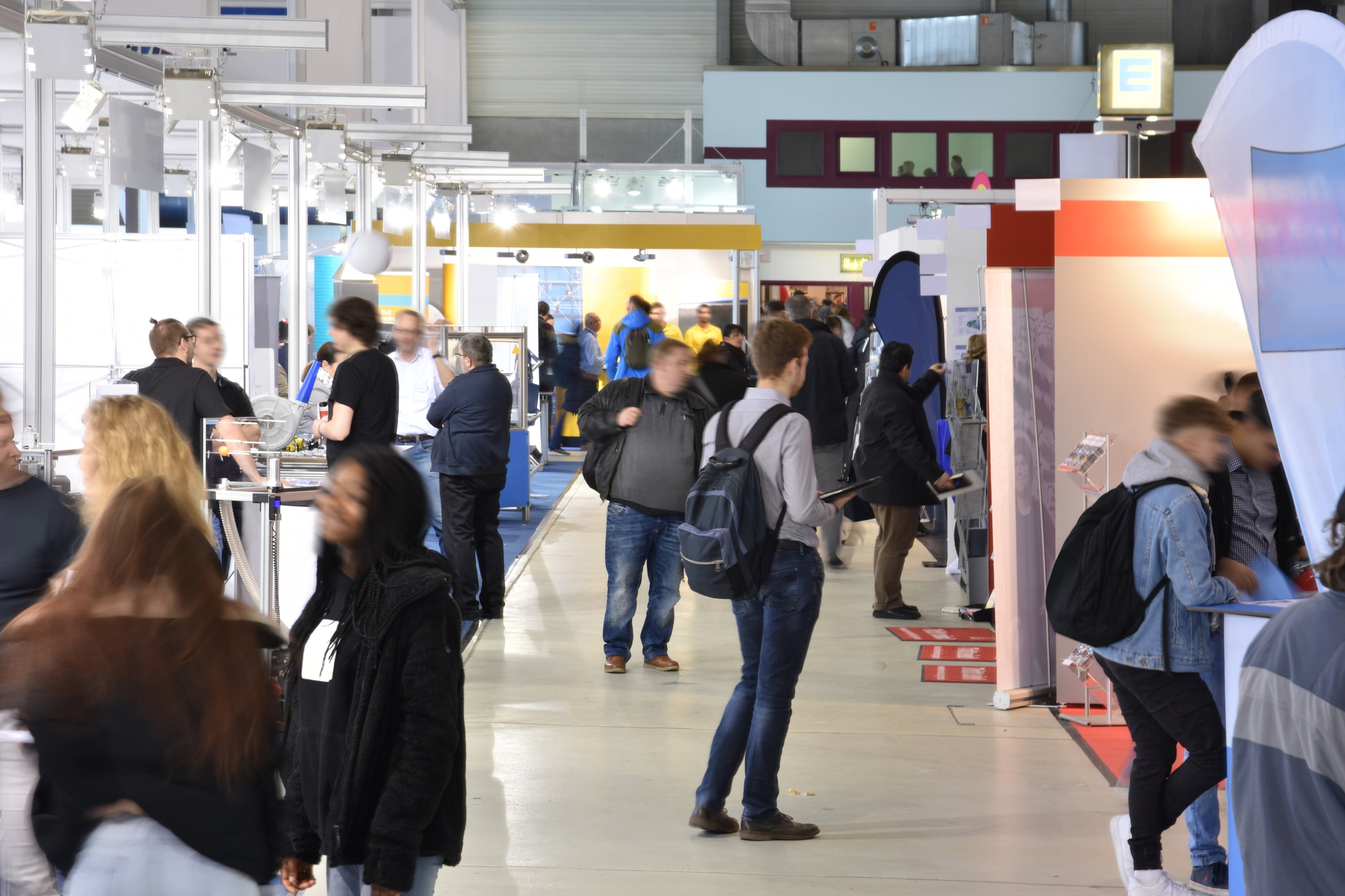 trade show picture of booths and peope